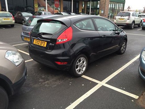 jerk who can't park a tiny car